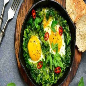 Ovos escalfados em cama de espinafres